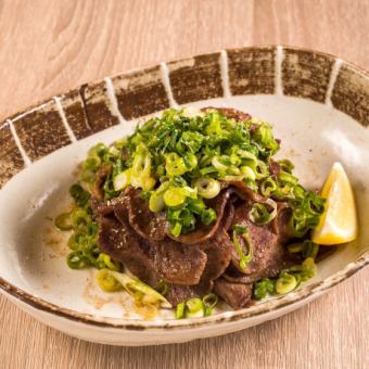 Crunchy beef tongue covered in green onions