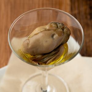Fresh oysters pickled in olive oil