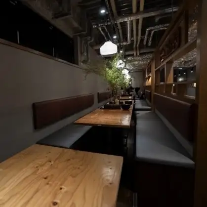 The tables in the back have elevated seating, creating a theater-like atmosphere where you can see the entire restaurant from a slightly elevated perspective.