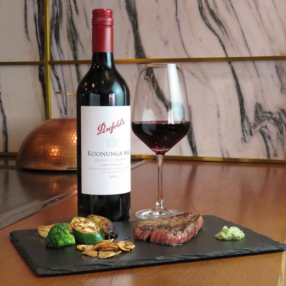 Steak cooked in front of you.And wine selected by the owner.