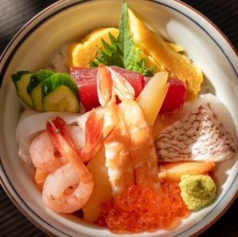 Bowl of rice topped with sashimi