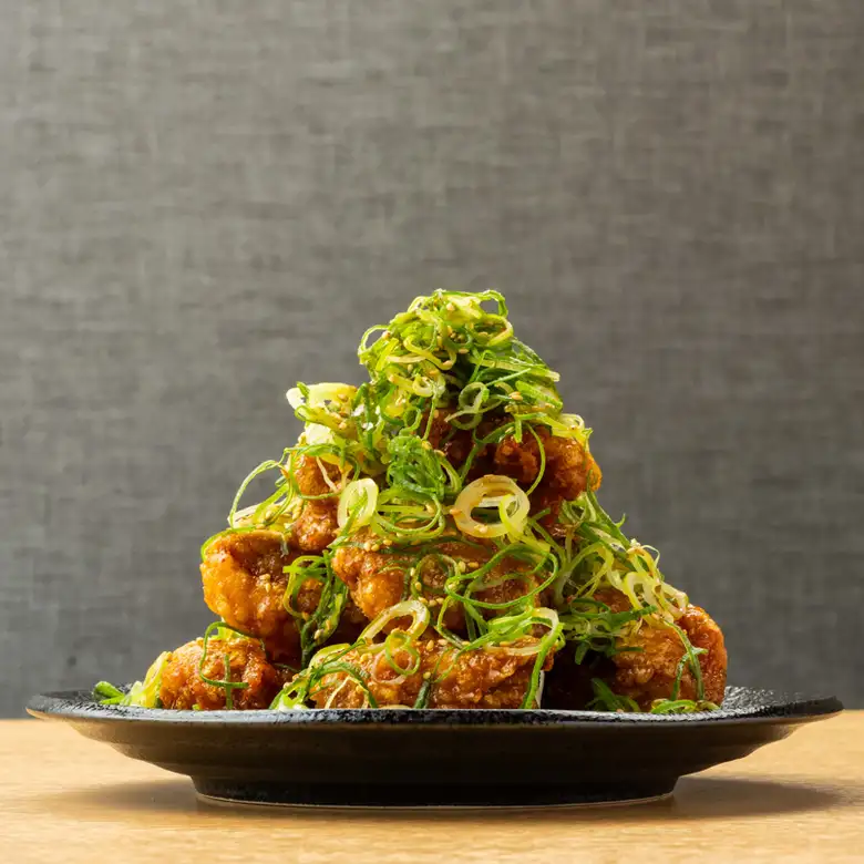 Mega-sized portion of fried chicken with lots of green onions