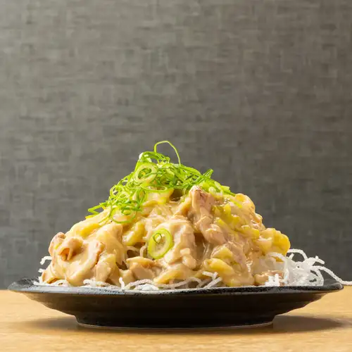 Mega-sized portion of fried vermicelli in a thick white broth sauce.