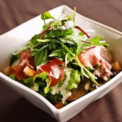 Caesar salad with serrano ham