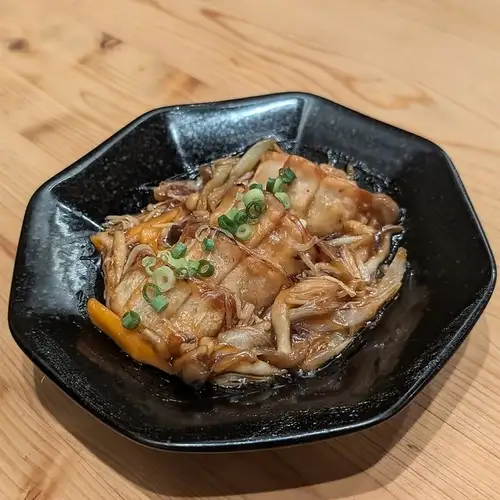 Deep-fried dumplings with mushroom sauce