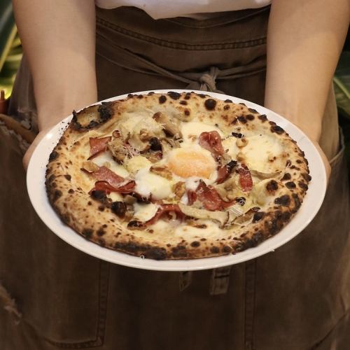 Porcini cream and walnut pizza with mortadella, salami and soft-boiled egg