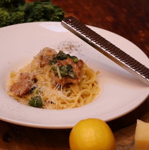 Homemade salsiccia, rape blossoms and cheese linguine