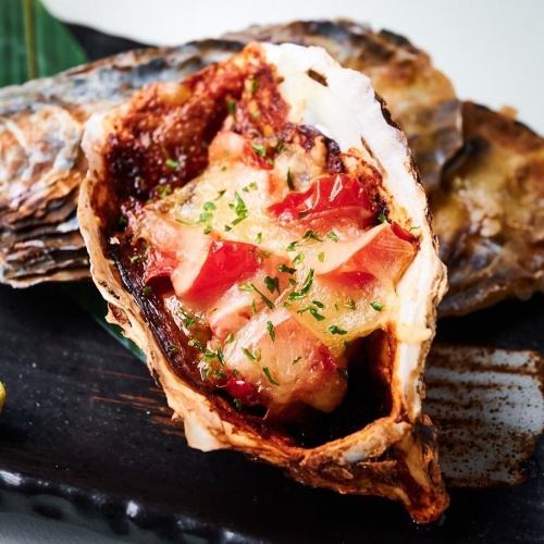 Grilled oysters with fresh tomatoes and cheese