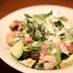 Shrimp and avocado Caesar salad with soft-boiled egg