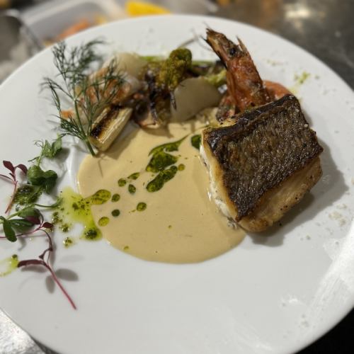 Sautéed fish of the day with seasonal vegetables