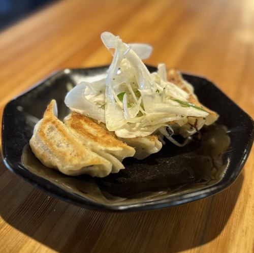 Gyoza dumplings with green onion and salt sauce