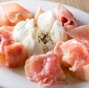 With seasonal fruits, burrata cheese and prosciutto.