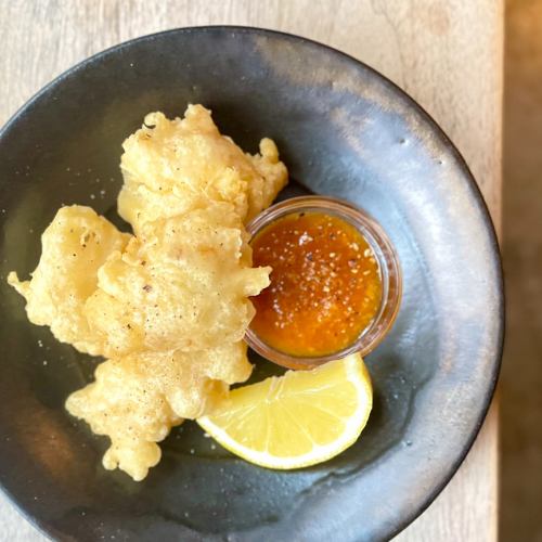 Monkfish fritters with Tarocco orange and garlic sauce