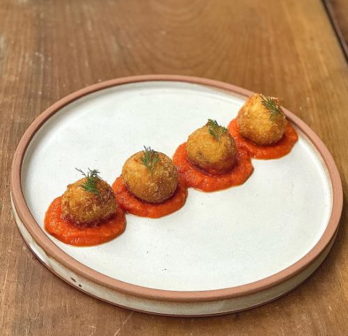 Homemade crab cream croquettes with tomato cream cheese sauce