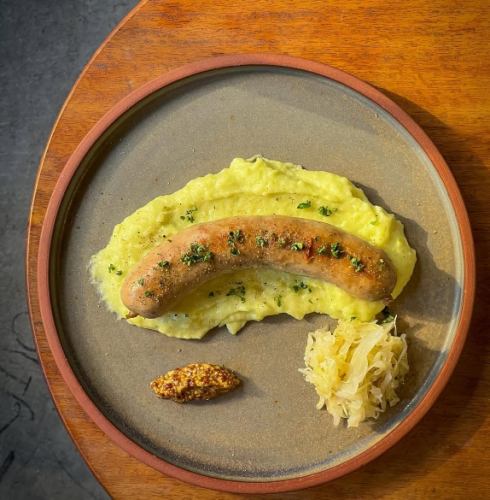Homemade sausage with seasonal vegetable puree