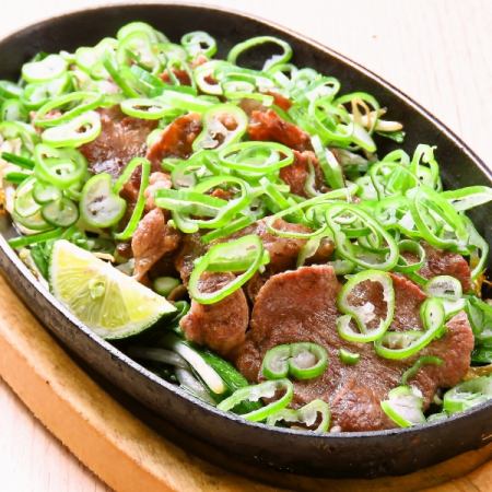 Beef tongue covered with green onions