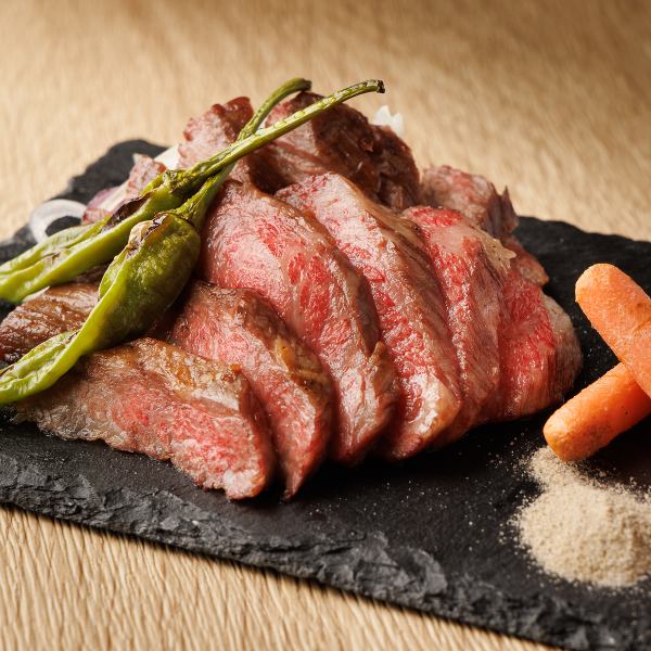 Kuroge Wagyu beef raised in a natural environment surrounded by the sea, feeding on grass exposed to the sea breeze.