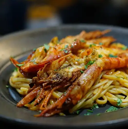 Linguine with red shrimp in tomato sauce
