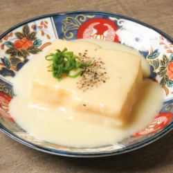 Rolled egg with cheese sauce