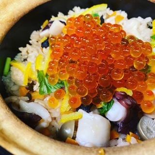 Local octopus and salmon roe in clay pot rice