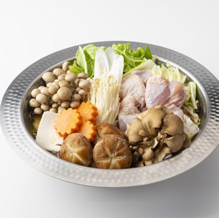 Dinner hot pot course featuring seasonal vegetables and meat in homemade soup