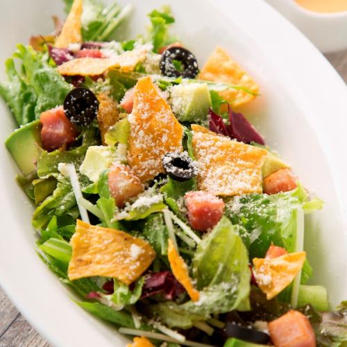 Mexican salad with bacon and tortilla chips