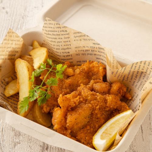 2 pieces of fried chicken with french fries