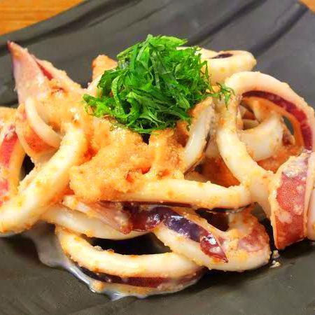 Grilled squid and cod roe topped with perilla