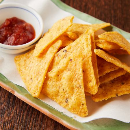 Tortilla chips with salsa sauce