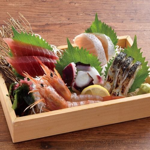 Five pieces of raw fish sashimi