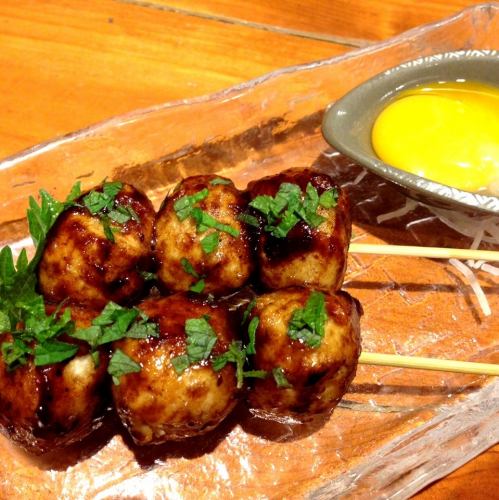 Grilled red chicken meatballs on skewers