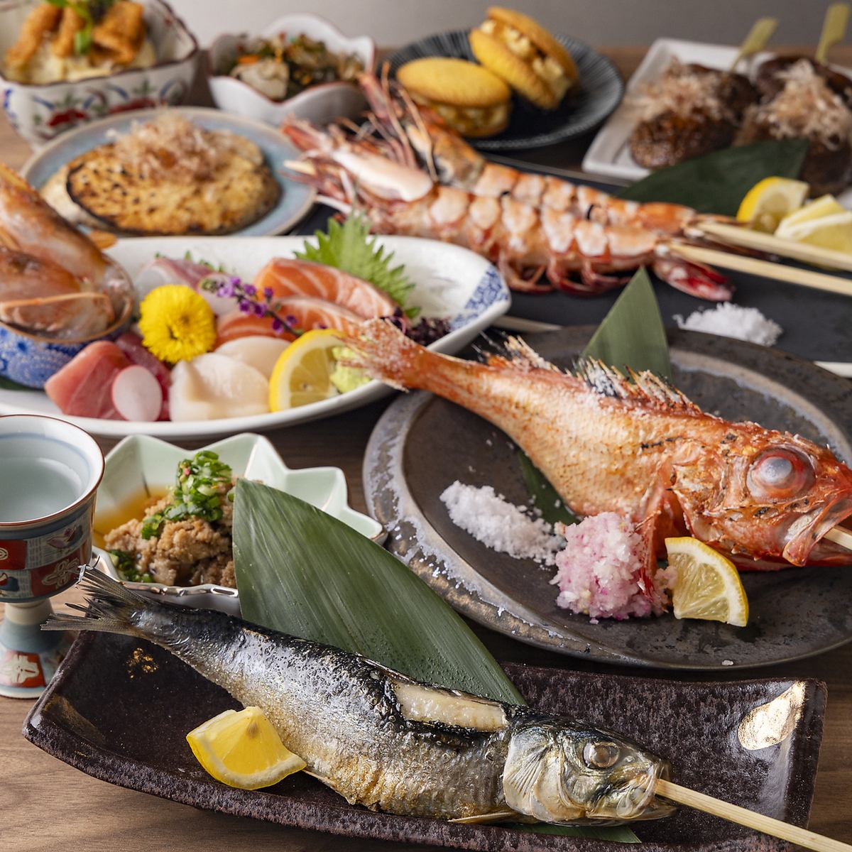 Primitive grilling of seasonal fish such as extra large fatty sardines and extra large shrimp, grilled over a hearth!