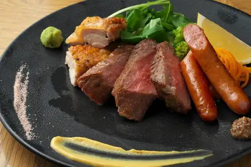 A luxurious grilled platter of three kinds of meat.