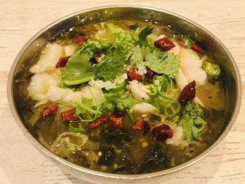 Sour and spicy stew of white fish and mustard greens