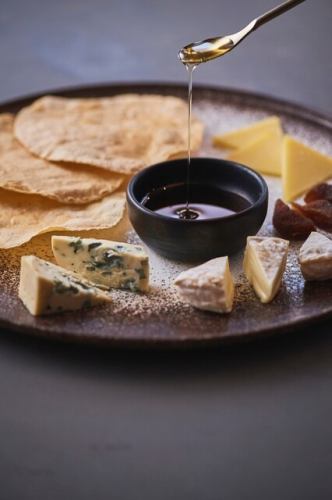 Cheese plate with agave syrup and tostadas