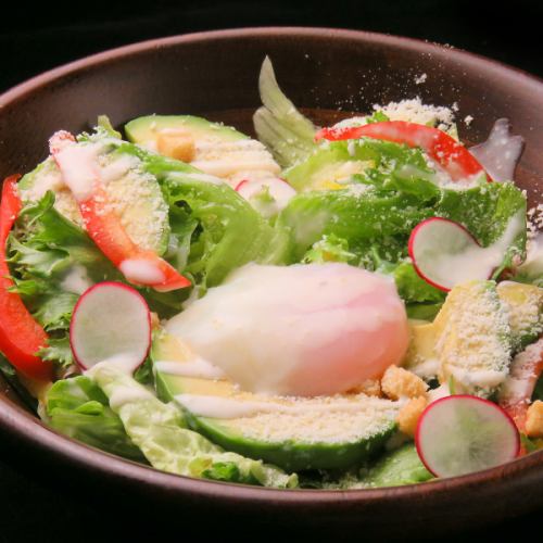 Caesar salad with avocado and hot spring egg