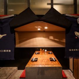 It is a semi-private room seperated by a sake brewery front.