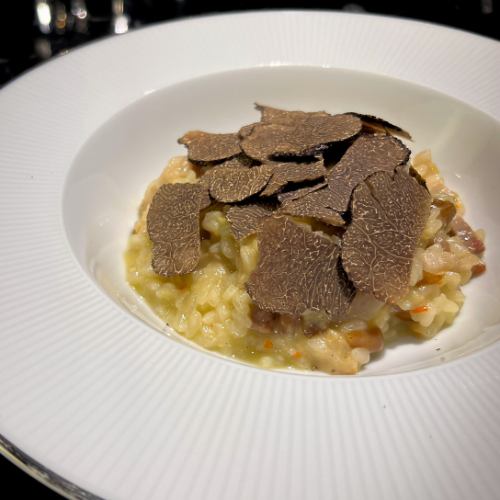 Pancetta and porcini risotto topped with plenty of truffles