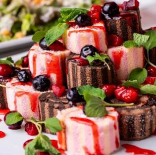 Assortment of seasonal fruits and cakes