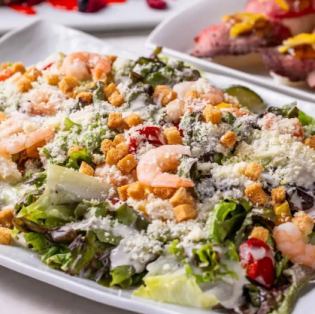 Caesar salad with grilled vegetables and shrimp
