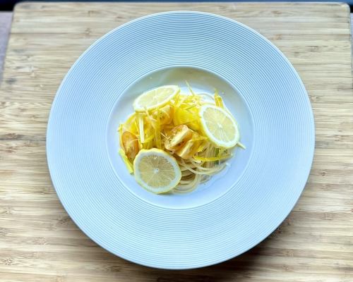 Yellow vegetables and seafood in lemon cream sauce