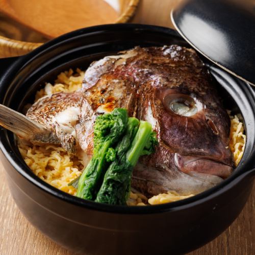 Sea bream rice served in a hot earthenware pot