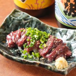 Chicken liver sashimi topped with spring onions