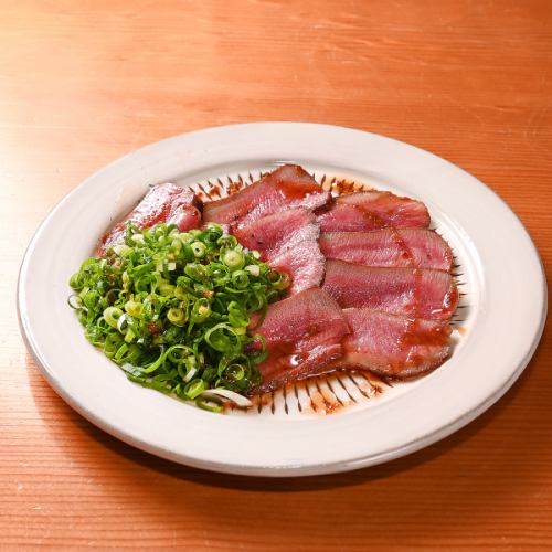 A specialty.Beef tongue beaten, covered with negi