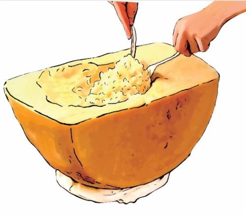 Parmigiano risotto in a large cheese bowl