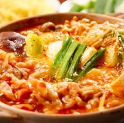 Your body will be pleased! Korea's signature kimchi jjigae hotpot, with its rich, spicy soup and irresistible flavors of ingredients
