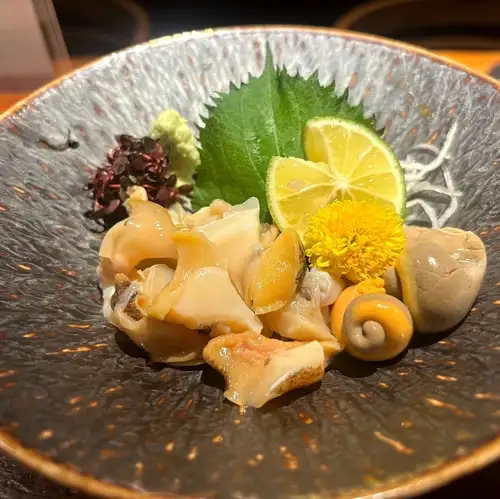 Live whelk sashimi