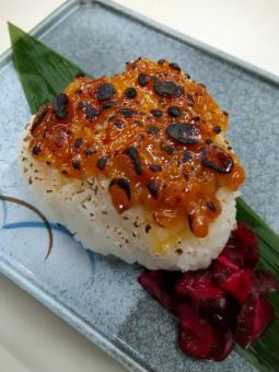 Grilled rice balls with small sardines and green shiso