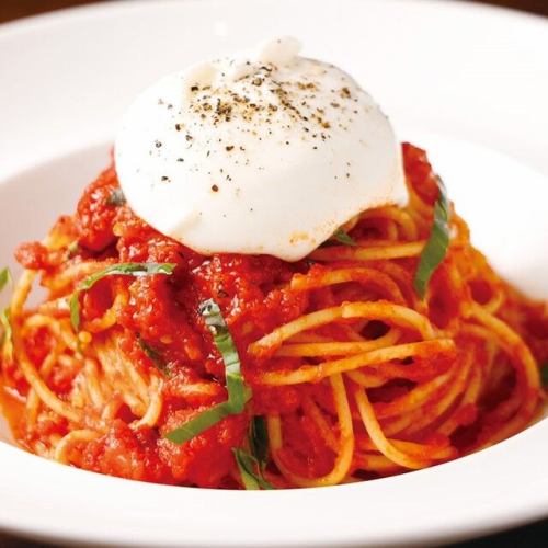 Fresh tomato pasta topped with burrata cheese