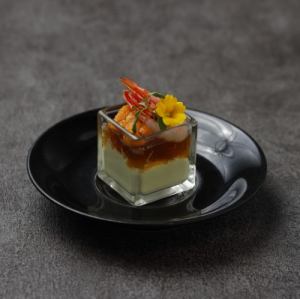 Seasonal vegetable mousse topped with sea urchin and sweet shrimp and lobster consommé jelly (1 serving)